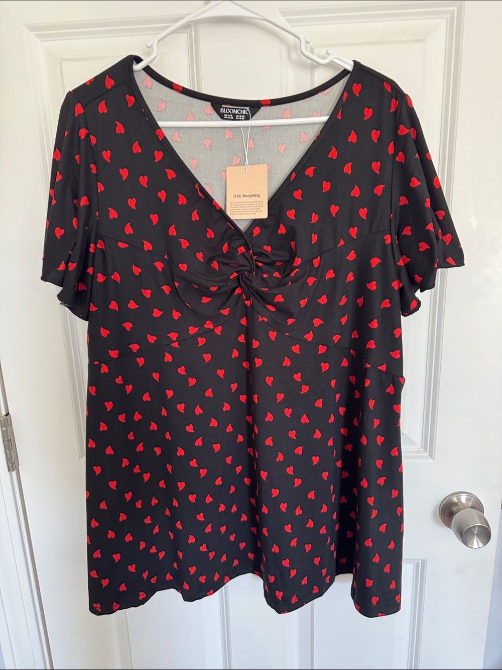 NWT BloomChic Black V-Neck Tunic with Red Heart Print and Twist Front